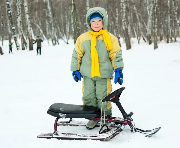 Boy with a sledge — Stock Photo, Image