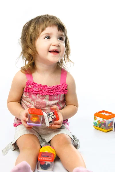 Dívka si hraje se svými hračkami — Stock fotografie