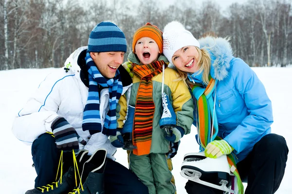 Family going ice skating Royalty Free Stock Photos