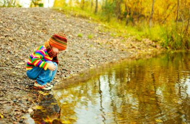 Boy near the lake clipart