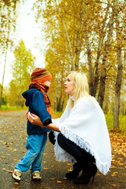 Mother talking to her son clipart