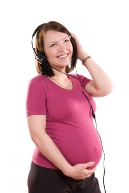 Pregnant woman listening to the music clipart