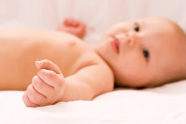Four months old boy on the bed — Stock Photo, Image