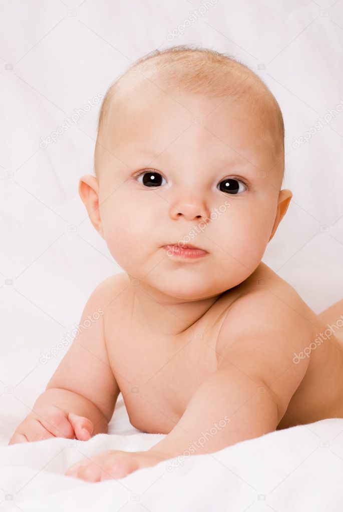 Cute four months old baby boy on the bed — Stock Photo ...