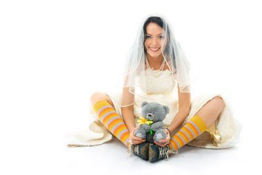 Funny bride wearing sporting shoes with a toy clipart