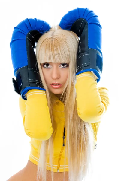Scared woman wearing boxing gloves — Stock Photo, Image