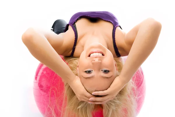 Beautiful woman works out on the fitness ball — Stock Photo, Image