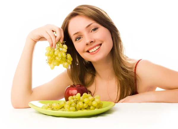 Mulher bonita com uma maçã e uvas — Fotografia de Stock
