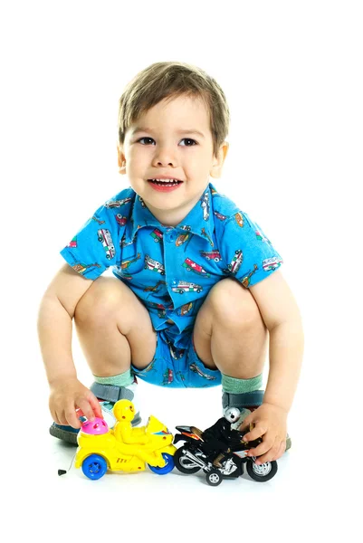 Carino ragazzo giocare con giocattoli — Foto Stock