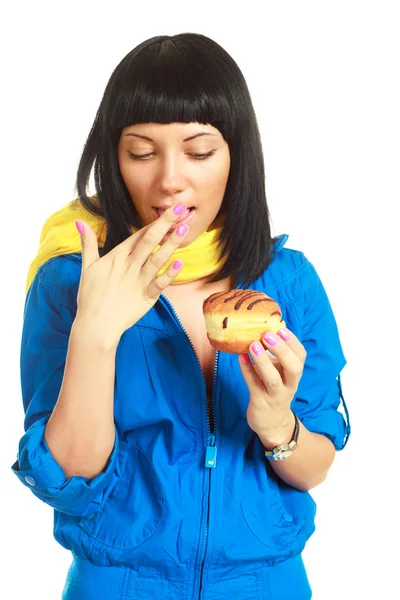 Girl eating a roll with chocolate — Stock Photo, Image