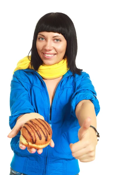 Girl giving us a roll with chocolate — Stock Photo, Image