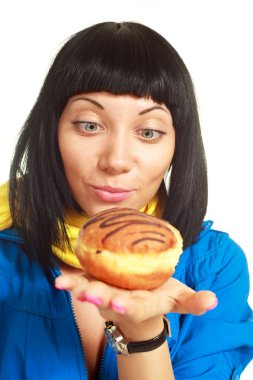 Girl eating a roll with chocolate clipart