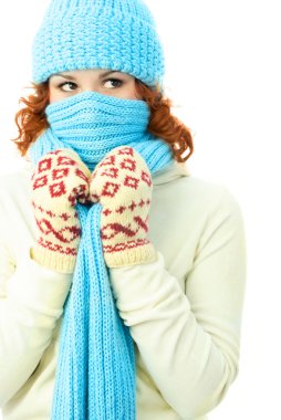 Young ginger woman wearing warm winter clothes clipart