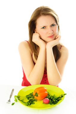 Displeased woman keeping a diet clipart