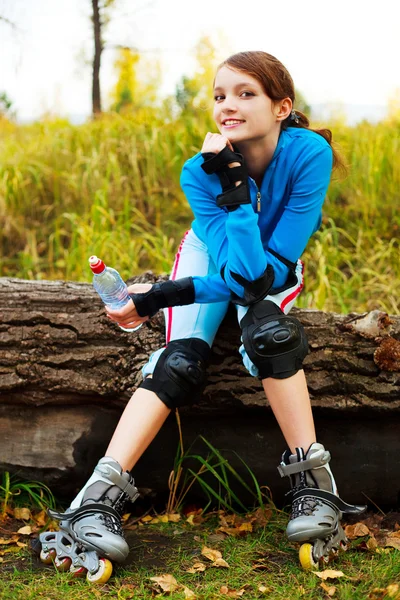 Girl with rollerskates — Stock Photo, Image