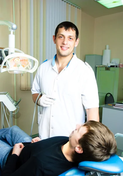 Dentist and his patient — Stock Photo, Image
