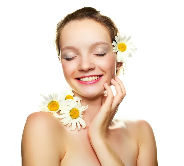 Girl with many camomile flowers — Stock Photo, Image