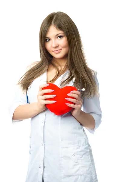 Cardiologista com um travesseiro em forma de coração — Fotografia de Stock