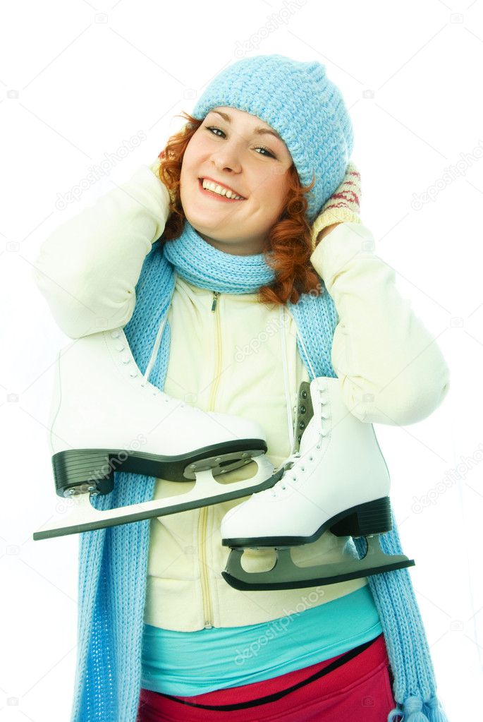 Cheerful young woman goes ice-skating