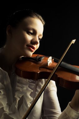 Beautiful woman playing the viloin clipart