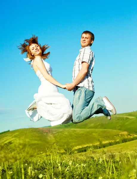 Jumping couple — Stock Photo, Image