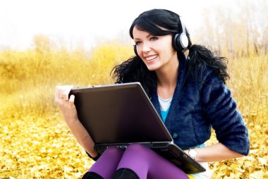 Woman with a laptop clipart