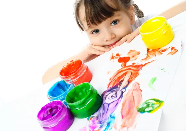 Cute girl painting with finger paints — Stock Photo, Image