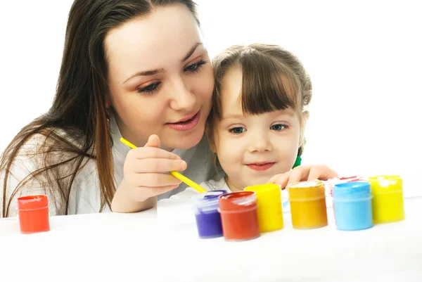 stock image Mother and daughter painting with watercolor