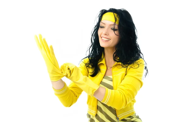 Vrouw zet op rubber handschoenen — Stockfoto
