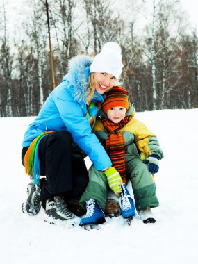 Mother and son ice skating clipart