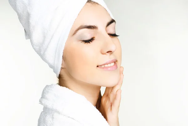 Pretty girl wrapped into white towel — Stock Photo, Image