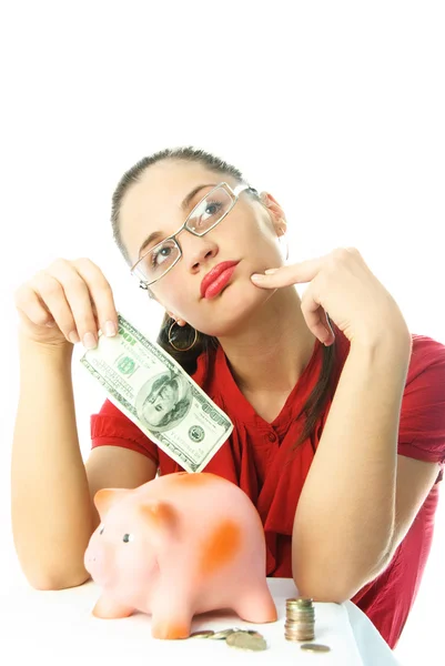 Yougn woman with a piggy bank — Stock Photo, Image