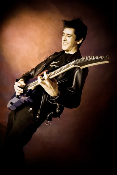 Rock-star playing guitar — Stock Photo, Image