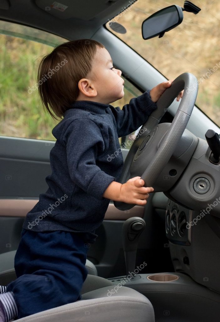 little boy driving