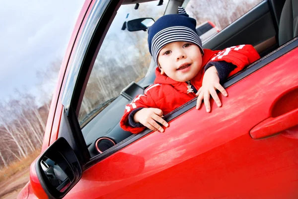 Cute little boy in the car — Stock Photo, Image