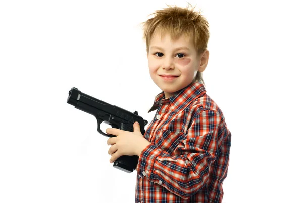 Rapaz alegre com uma arma — Fotografia de Stock