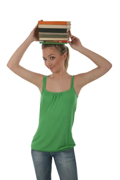 Menina segurando livros — Fotografia de Stock