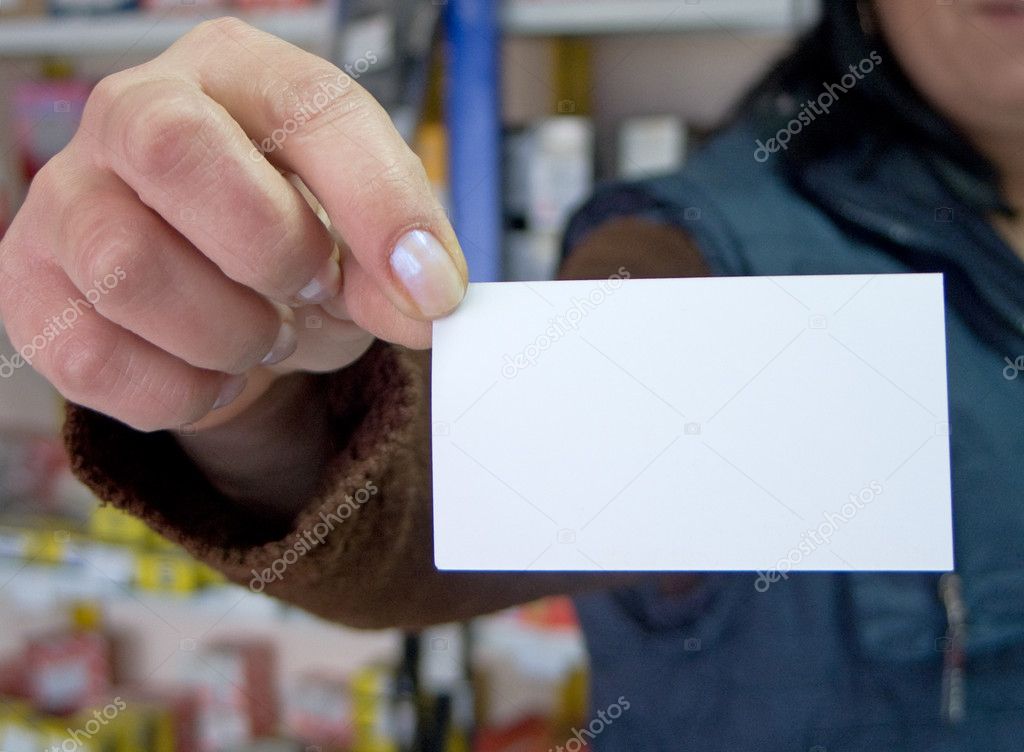 Woman holding blank visit card