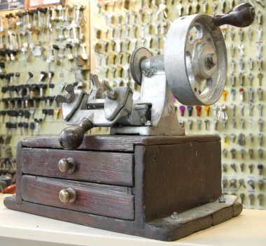 Old key duplicating machine clipart