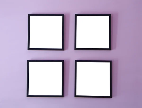 Cuatro marcos en la pared Imagen de stock