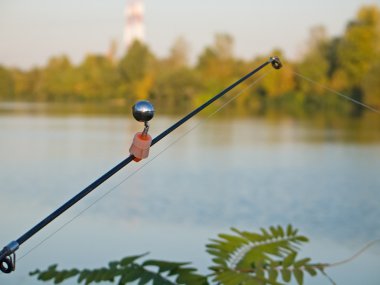 Fishing rod with signal bell clipart