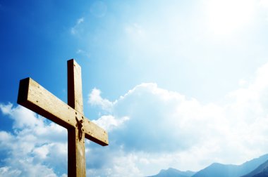 Cross on the blue sky clipart