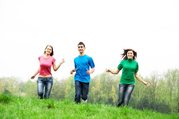 Happy friends jumping Stock Image