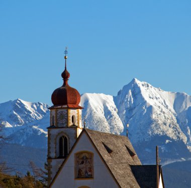 Church in alipine scenery clipart