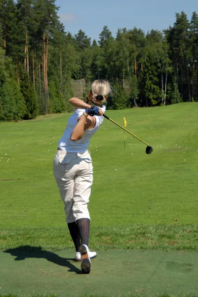 Lady golfare swing Stockfoto