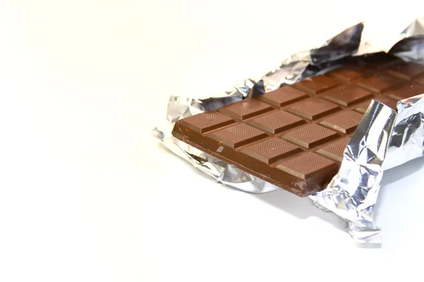 Chocolate bar with open cover — Stock Photo, Image