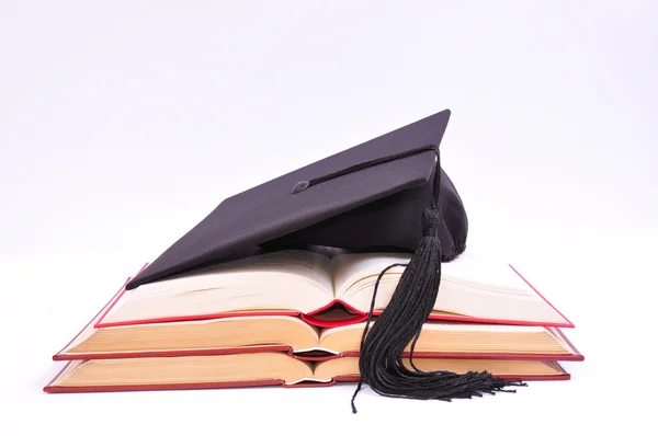 Öğrenci şapka ve kitaplar — Stok fotoğraf