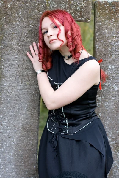 Gothic girl on a cemetery — Stock Photo, Image