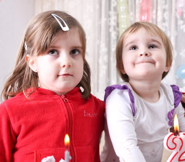 Two girls with birthday cake — Stock Photo, Image