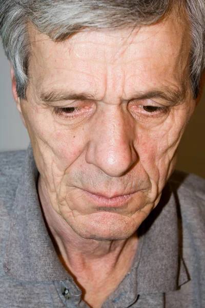 Closeup of a senior man looking away in deep tho — Stock Photo, Image